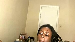 Ebony MILF masturbates with dildo and smokes